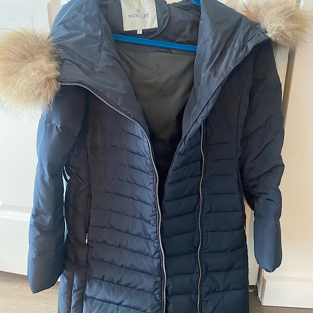 Used women’s down Moncler jacket for sale (size 2). Detachable fox fur hood.